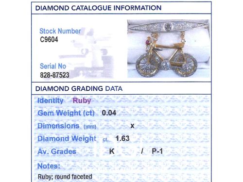 fig 10. An antique Edwardian bar brooch featuring a suspended yellow gold bicycle with diamond-set wheels, set beneath a platinum-faced bar set with diamonds.