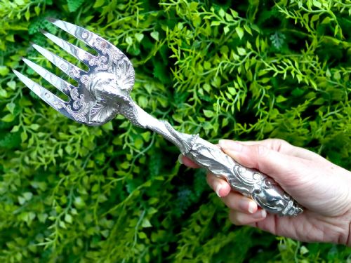 fig 2. An engraved Victorian sterling silver fish serving knife and fork set presented inside a fitted black box.