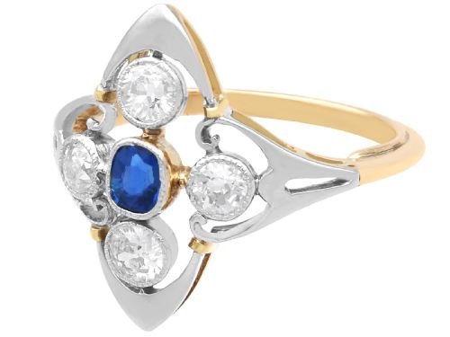 fig 6. An Art Deco 14ct yellow gold ring featuring a central oval blue sapphire surrounded by four round diamonds set in a diamond-shaped openwork frame.