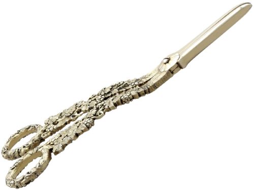 fig 4. A pair of Victorian sterling silver gilt grape shears featuring cast grapevine and leaf motifs along the handles.