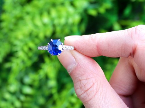 fig 1. An Art Deco platinum solitaire ring set with an octagonal blue Burmese sapphire flanked by diamond-set shoulders.