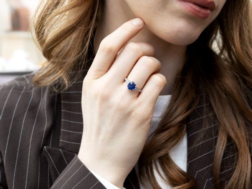 fig 2. An Art Deco platinum solitaire ring set with an octagonal blue Burmese sapphire flanked by diamond-set shoulders.