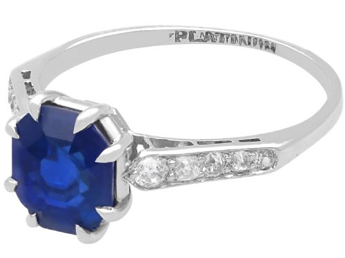 fig 5. An Art Deco platinum solitaire ring set with an octagonal blue Burmese sapphire flanked by diamond-set shoulders.