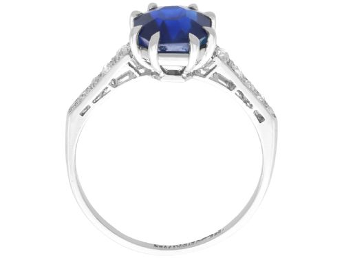 fig 7. An Art Deco platinum solitaire ring set with an octagonal blue Burmese sapphire flanked by diamond-set shoulders.
