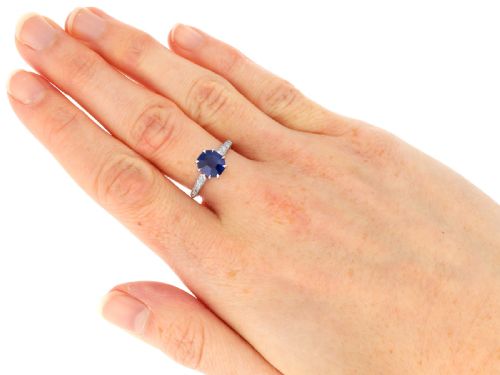 fig 8. An Art Deco platinum solitaire ring set with an octagonal blue Burmese sapphire flanked by diamond-set shoulders.
