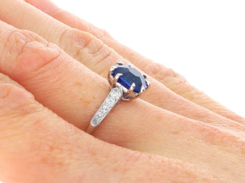 fig 9. An Art Deco platinum solitaire ring set with an octagonal blue Burmese sapphire flanked by diamond-set shoulders.
