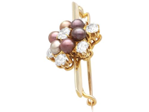 fig 6. An antique 15ct yellow gold bar brooch featuring a central floral cluster set with dark pearls and old-cut diamonds.