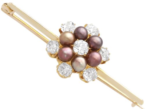 fig 7. An antique 15ct yellow gold bar brooch featuring a central floral cluster set with dark pearls and old-cut diamonds.