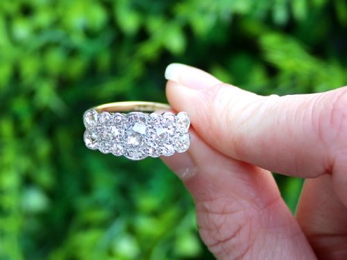 fig 1. An Edwardian 18ct yellow gold and platinum cluster ring set with multiple old-cut diamonds in a scalloped setting.