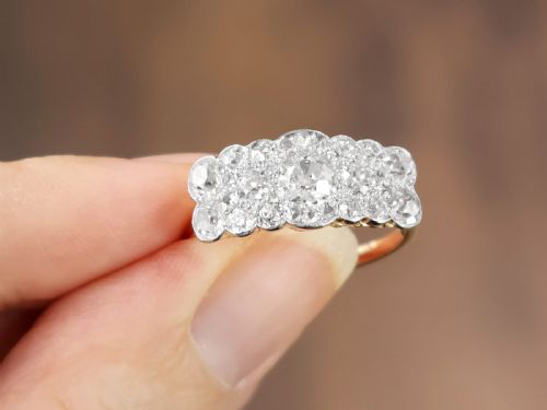 fig 2. An Edwardian 18ct yellow gold and platinum cluster ring set with multiple old-cut diamonds in a scalloped setting.