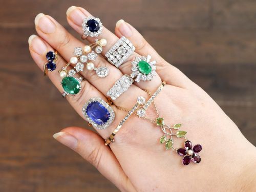 fig 4. An Edwardian 18ct yellow gold and platinum cluster ring set with multiple old-cut diamonds in a scalloped setting.