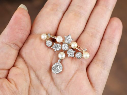 fig 3. An Edwardian 9ct yellow gold brooch featuring old cut diamonds, pearls, and a central drop pendant.