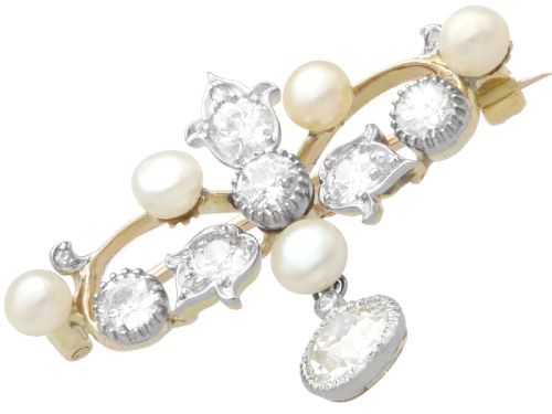 fig 7. An Edwardian 9ct yellow gold brooch featuring old cut diamonds, pearls, and a central drop pendant.