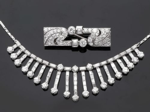 fig 3. An Art Deco platinum fringe necklace set with baguette and round cut diamonds arranged in a geometric drop pattern.