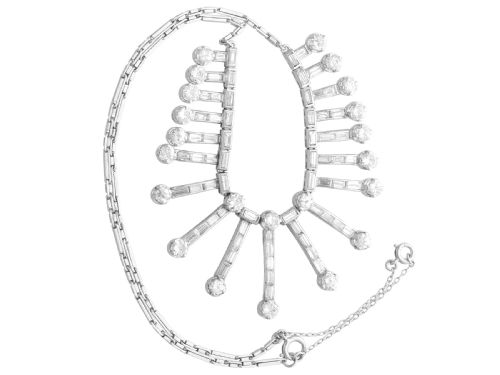 fig 5. An Art Deco platinum fringe necklace set with baguette and round cut diamonds arranged in a geometric drop pattern.