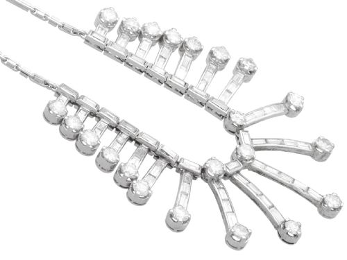 fig 6. An Art Deco platinum fringe necklace set with baguette and round cut diamonds arranged in a geometric drop pattern.