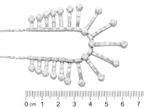 fig 8. An Art Deco platinum fringe necklace set with baguette and round cut diamonds arranged in a geometric drop pattern.