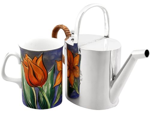 fig 2. An Edwardian sterling silver watering can featuring a cylindrical body, straight spout, overhead loop handle, woven cane side handle, and an engraved central monogram.