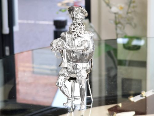 fig 6. A set of German sterling silver musician figures depicting a miniature band with instruments in historic costume.