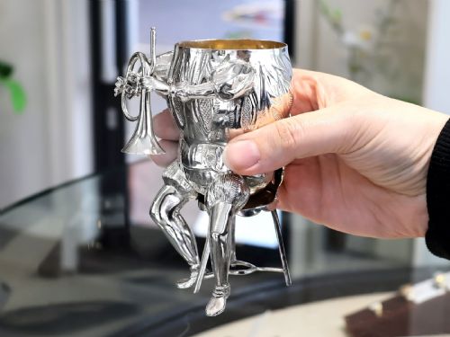 fig 8. A set of German sterling silver musician figures depicting a miniature band with instruments in historic costume.