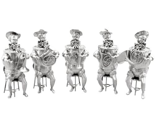 fig 9. A set of German sterling silver musician figures depicting a miniature band with instruments in historic costume.