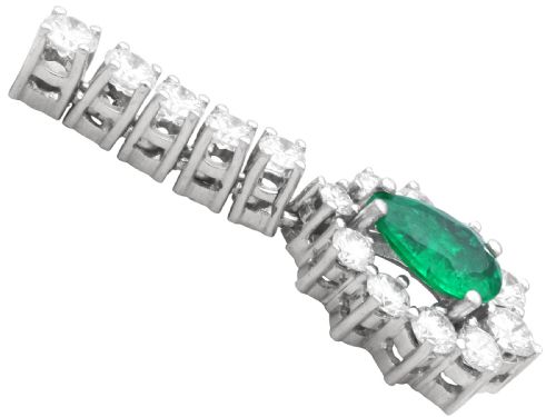 fig 4. A pair of 18ct white gold drop earrings featuring pear-cut green emeralds surrounded by round diamond halos suspended from vertical diamond bars.