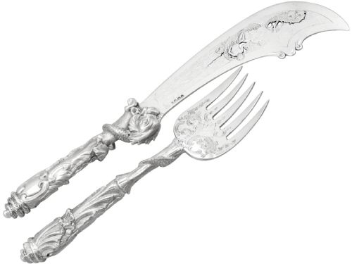 fig 6. An engraved Victorian sterling silver fish serving knife and fork set presented inside a fitted black box.