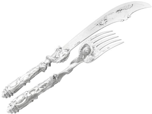 fig 7. An engraved Victorian sterling silver fish serving knife and fork set presented inside a fitted black box.