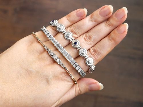fig 2. A vintage 18ct white gold articulated link bracelet set with alternating bezel-mounted round diamonds and blue sapphires.