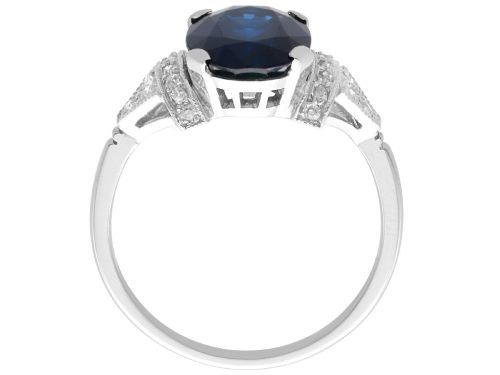 fig 5. An Art Deco platinum ring featuring a centrally set oval blue sapphire flanked by diamond-set geometric shoulders.