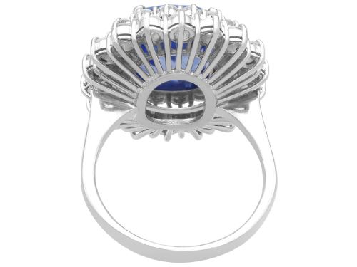 fig 6. A vintage 14ct white gold cluster ring featuring a centrally mounted cushion-cut blue Ceylon sapphire surrounded by a double halo of round brilliant diamonds.