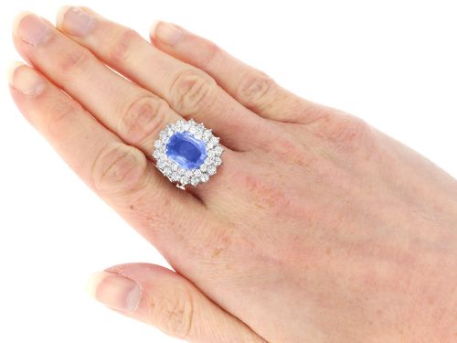 fig 8. A vintage 14ct white gold cluster ring featuring a centrally mounted cushion-cut blue Ceylon sapphire surrounded by a double halo of round brilliant diamonds.
