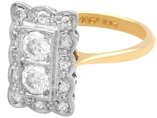 fig 6. An Art Deco 18ct yellow gold dress ring with two central round diamonds within a rectangular millegrain halo setting.