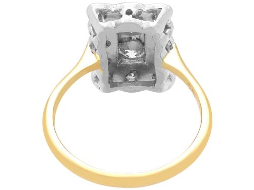 fig 7. An Art Deco 18ct yellow gold dress ring with two central round diamonds within a rectangular millegrain halo setting.