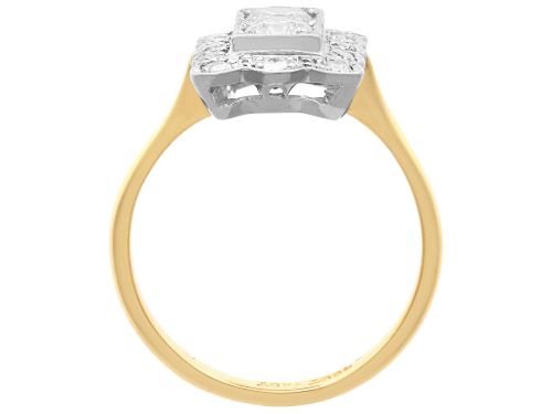 fig 8. An Art Deco 18ct yellow gold dress ring with two central round diamonds within a rectangular millegrain halo setting.