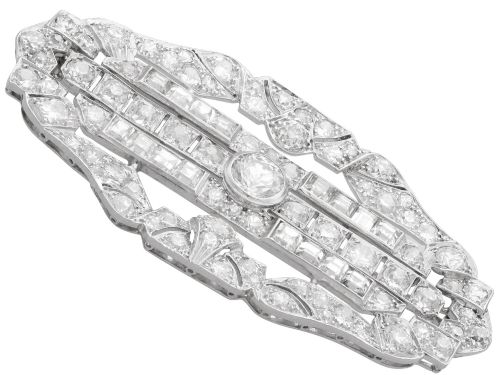 fig 6. An Art Deco platinum brooch styled in an elongated geometric openwork plaque pattern, set throughout with brilliant and square-cut diamonds.