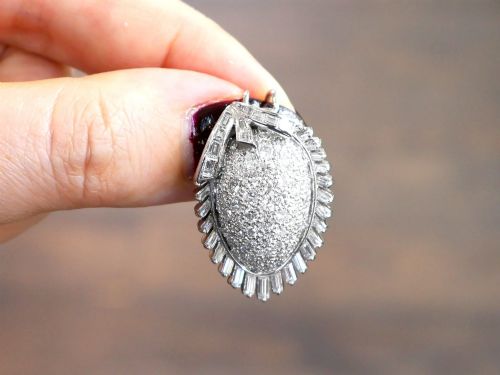 fig 3. A 1950s vintage white gold organic pendant set with brilliant-cut diamonds and bordered by baguette-cut diamonds.