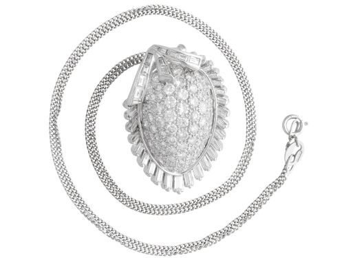 fig 6. A 1950s vintage white gold organic pendant set with brilliant-cut diamonds and bordered by baguette-cut diamonds.