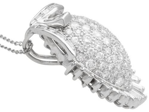 fig 7. A 1950s vintage white gold organic pendant set with brilliant-cut diamonds and bordered by baguette-cut diamonds.