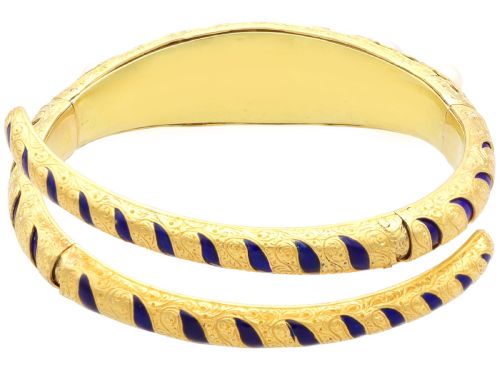 fig 8. A Victorian hinged yellow gold bangle featuring detailed hand engraving, deep blue enamel panels, set diamonds, and graduated natural pearls.