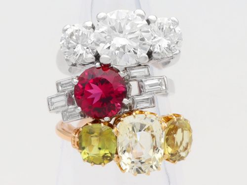 fig 5. An Art Deco platinum ring featuring a round pink tourmaline centre stone set between stepped shoulders of baguette-cut diamonds.