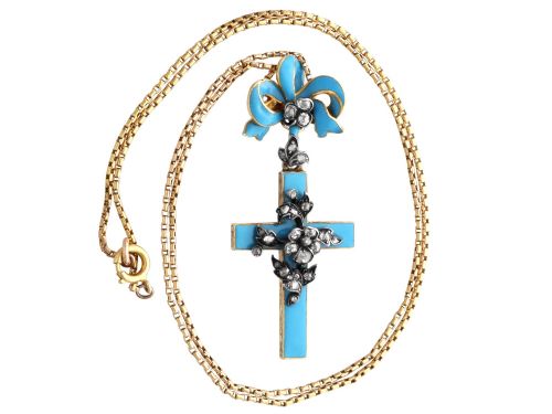 fig 6. A Georgian 15ct yellow gold cross pendant featuring blue enamel, a diamond-set ribbon bow loop, and floral diamond overlays.