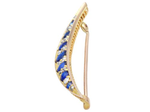 fig 5. An antique late Victorian 9ct yellow gold crescent brooch set with graduated oval blue sapphires and accent diamonds.
