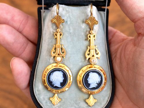 fig 3. A pair of late Victorian 22ct yellow gold drop earrings featuring hand-carved hardstone cameo profile portraits and small seed pearls.