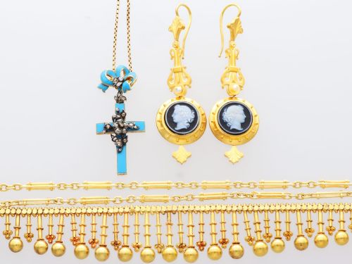fig 5. A pair of late Victorian 22ct yellow gold drop earrings featuring hand-carved hardstone cameo profile portraits and small seed pearls.