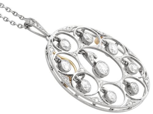 fig 5. An Art Deco circular platinum pendant featuring openwork wirework circles set with diamonds, suspended from a fine chain.