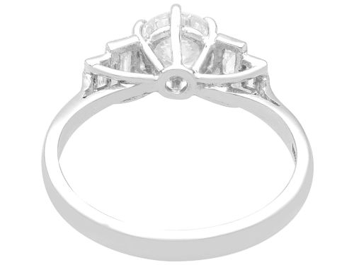 fig 4. An 18ct white gold Art Deco ring featuring a central round diamond flanked by stepped baguette diamond shoulders.