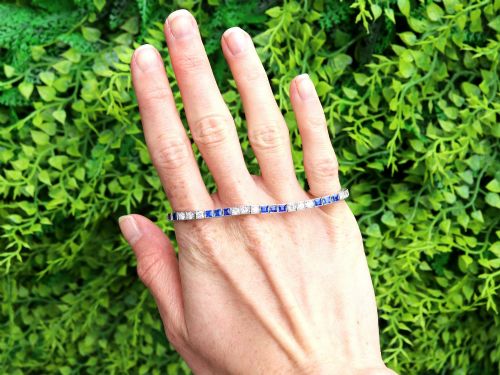 fig 1. An Art Deco platinum line bracelet set with alternating square blue sapphires and round brilliant diamonds.