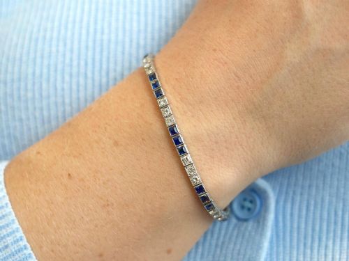 fig 3. An Art Deco platinum line bracelet set with alternating square blue sapphires and round brilliant diamonds.