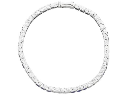 fig 6. An Art Deco platinum line bracelet set with alternating square blue sapphires and round brilliant diamonds.
